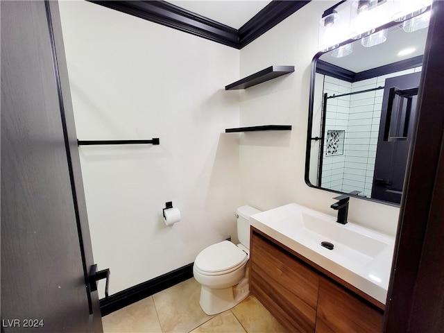 bathroom featuring a tile shower, crown molding, vanity, tile patterned flooring, and toilet