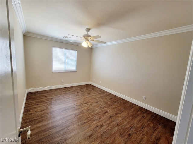 empty room with dark wood-type flooring, ornamental molding, and ceiling fan