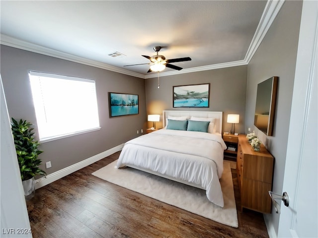 bedroom with ceiling fan, dark hardwood / wood-style flooring, and ornamental molding