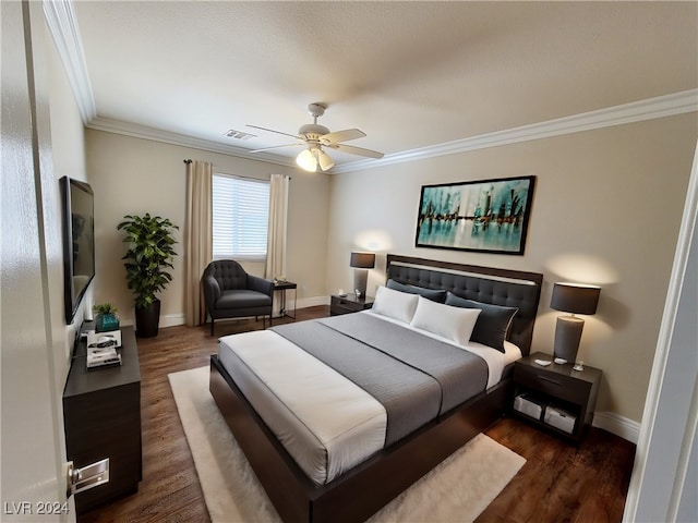 bedroom featuring crown molding, ceiling fan, and dark hardwood / wood-style floors