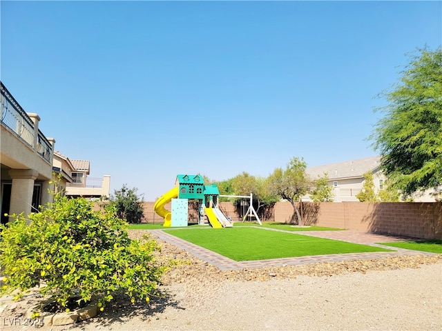 view of jungle gym with a lawn