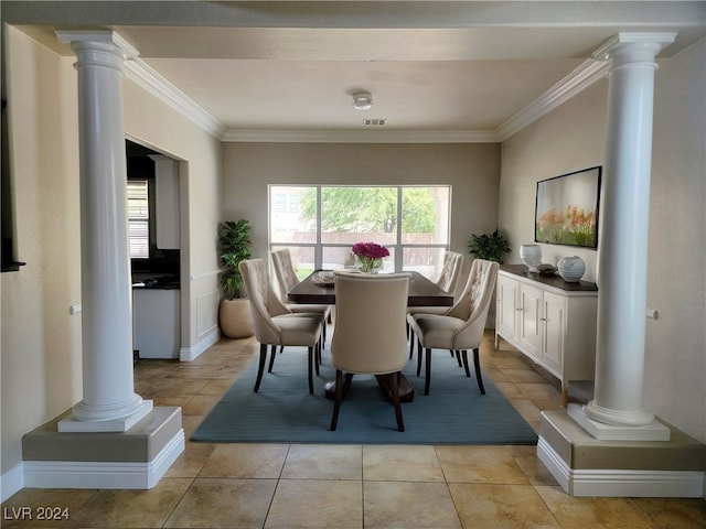 dining room with ornamental molding and light tile patterned floors