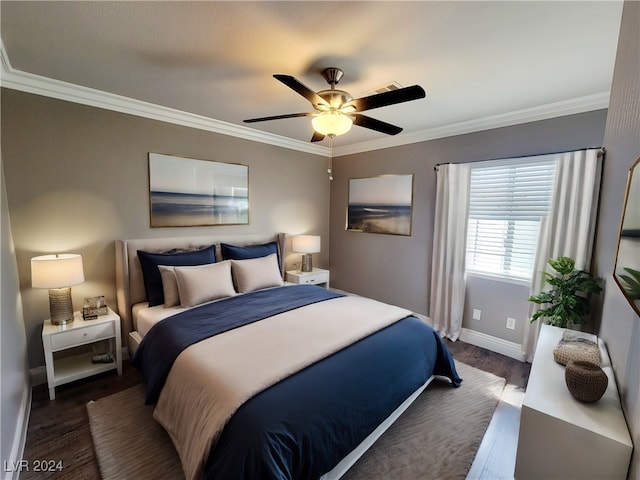 bedroom with ceiling fan, dark hardwood / wood-style floors, and crown molding