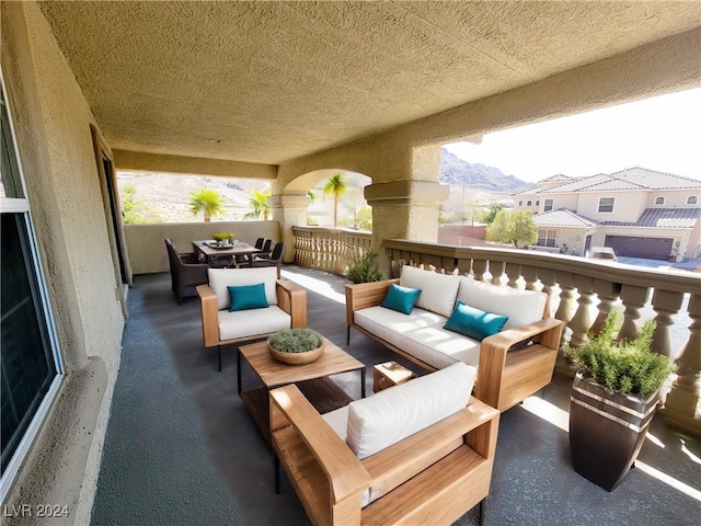 balcony featuring outdoor lounge area and a mountain view