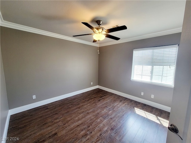 empty room featuring ornamental molding, dark hardwood / wood-style flooring, and ceiling fan