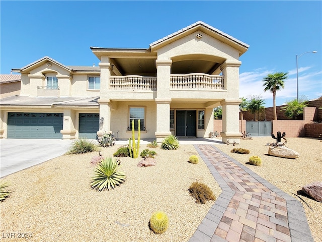 view of front of home featuring a garage and a balcony