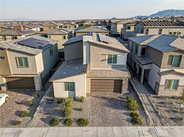 birds eye view of property with a mountain view