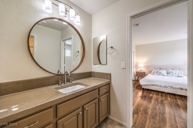 bathroom featuring hardwood / wood-style flooring and vanity