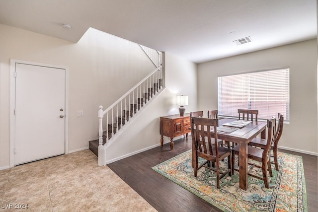 dining area with wood-type flooring