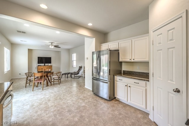 kitchen with dark stone countertops, dishwasher, white cabinetry, ceiling fan, and stainless steel fridge with ice dispenser