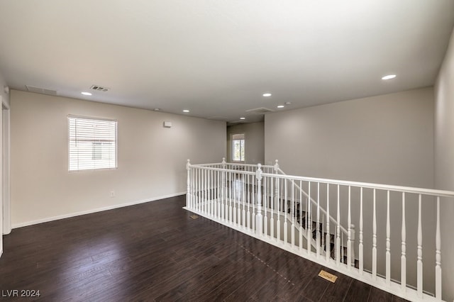 empty room featuring dark wood-type flooring