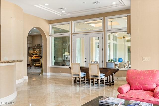 interior space featuring french doors and ceiling fan