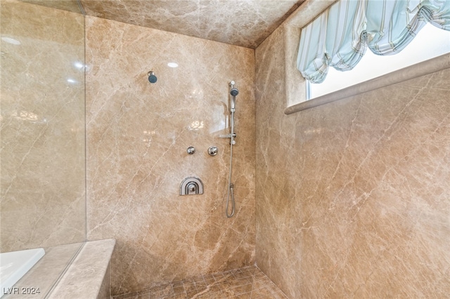 bathroom featuring tiled shower