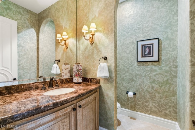 bathroom featuring toilet and vanity