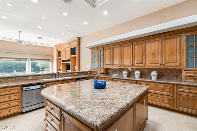 kitchen with tasteful backsplash, dishwasher, light stone counters, ceiling fan, and a center island with sink