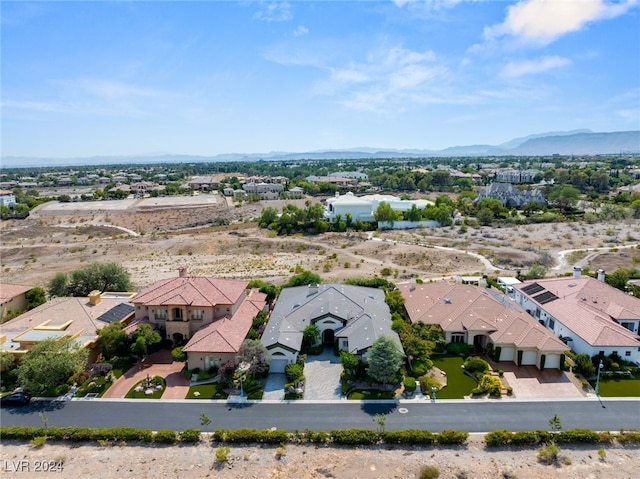 birds eye view of property with a mountain view