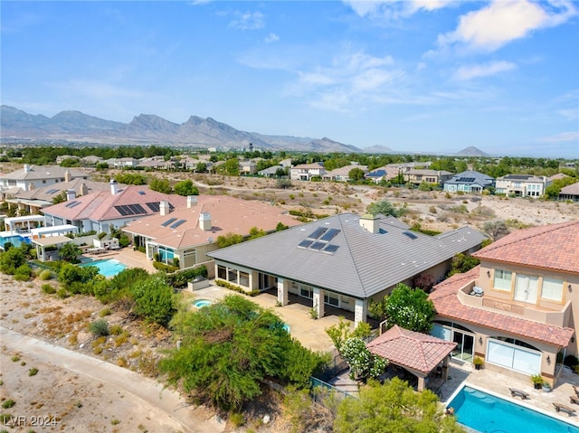 birds eye view of property featuring a mountain view