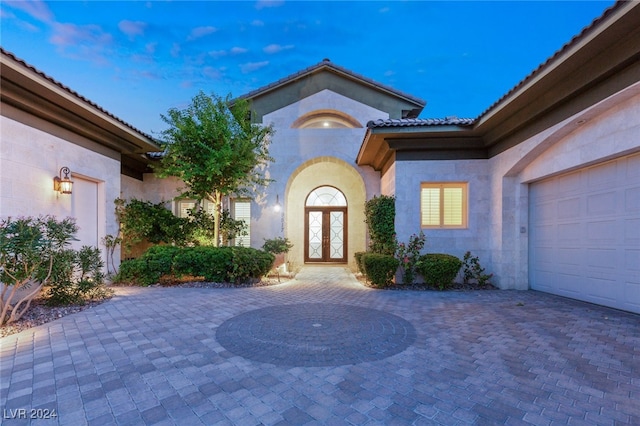 property entrance with a garage