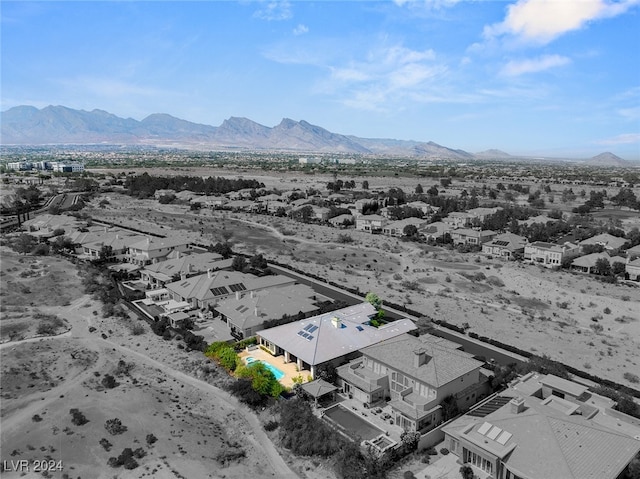 birds eye view of property featuring a mountain view