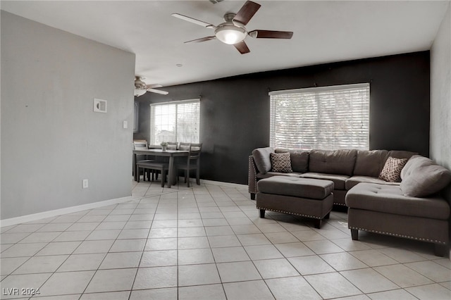 tiled living room featuring ceiling fan