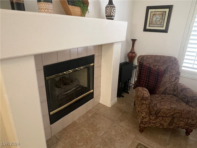 details with tile patterned flooring and a fireplace