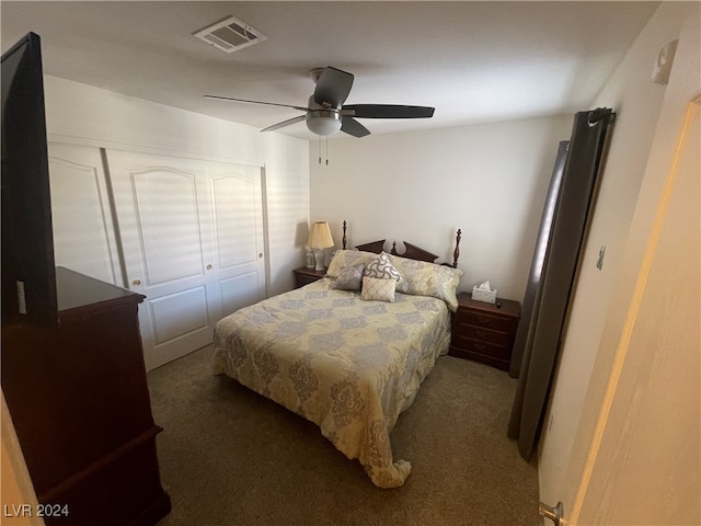 carpeted bedroom featuring a closet and ceiling fan