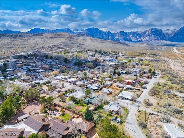 birds eye view of property with a mountain view and a residential view