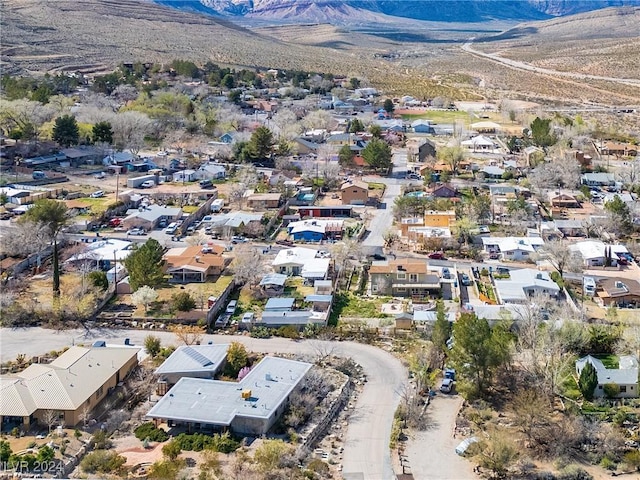 drone / aerial view with a residential view and a mountain view