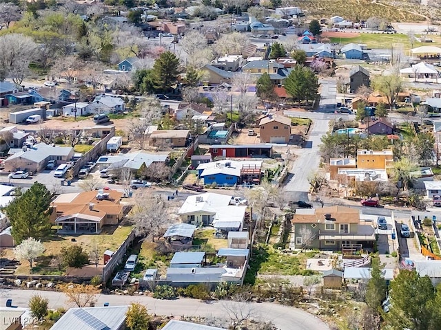 birds eye view of property with a residential view