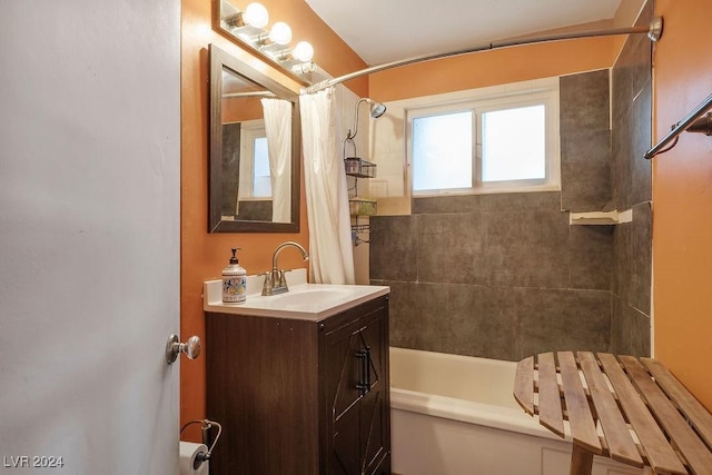 full bathroom featuring vanity and shower / bathtub combination with curtain