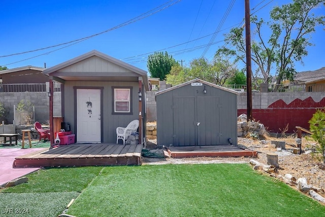 view of shed featuring fence