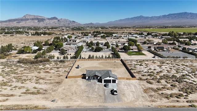 birds eye view of property with a mountain view