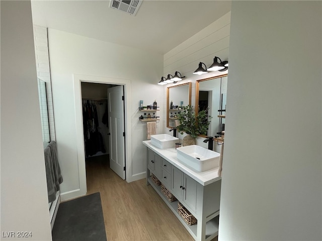 bathroom featuring vanity and hardwood / wood-style floors