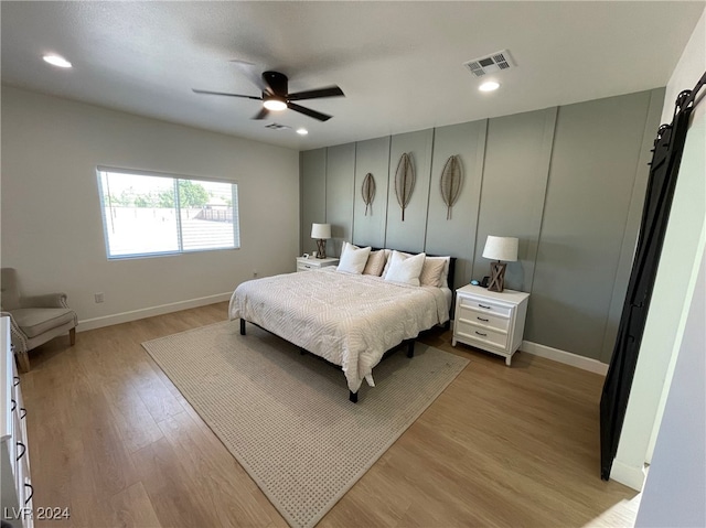 bedroom featuring ceiling fan and light wood-type flooring