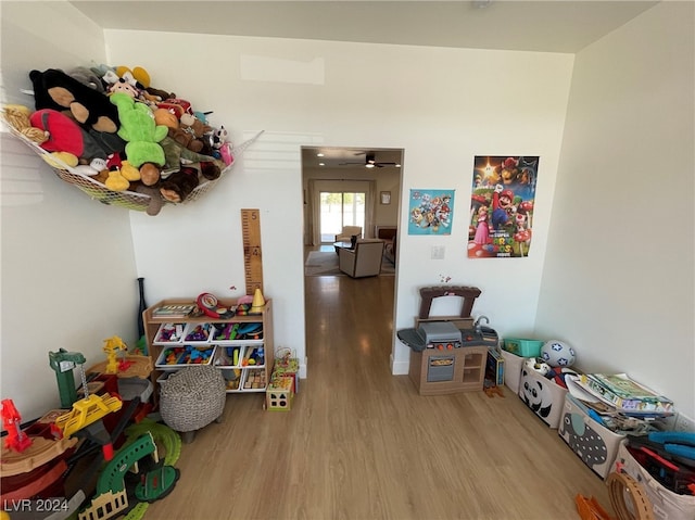 rec room featuring ceiling fan and hardwood / wood-style flooring