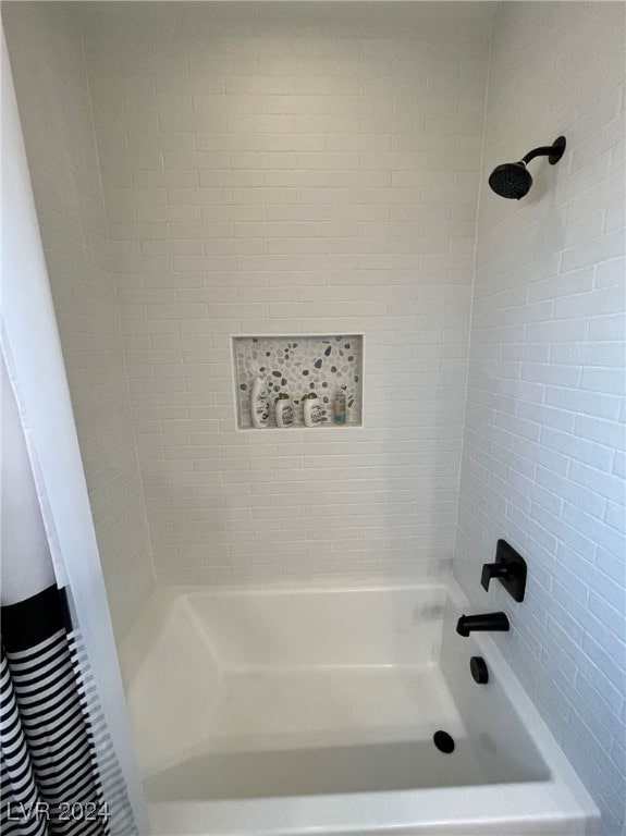 bathroom with shower / bath combo