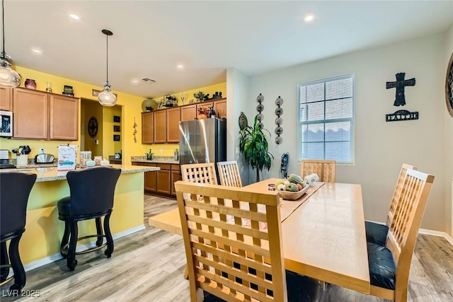 dining area featuring light hardwood / wood-style floors