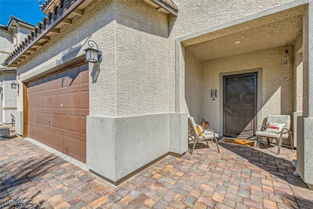 entrance to property featuring a garage