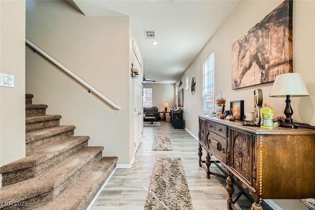 foyer entrance with light hardwood / wood-style floors