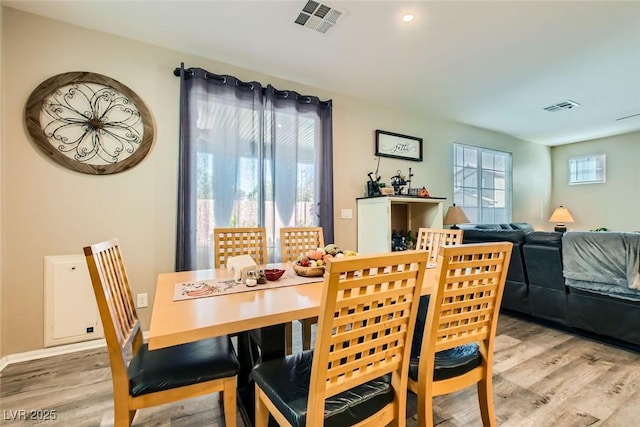 dining area with light hardwood / wood-style flooring