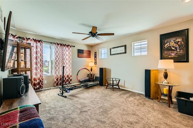 workout room with carpet floors and ceiling fan