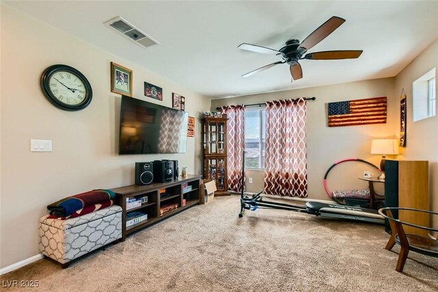 interior space featuring carpet floors and ceiling fan