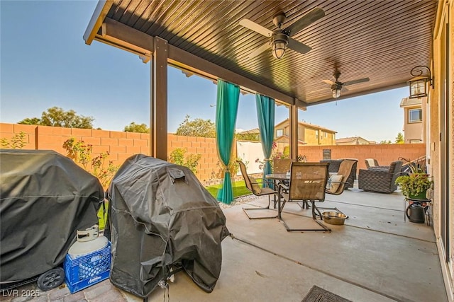 view of patio / terrace with area for grilling and ceiling fan