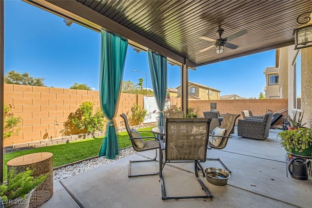 view of patio with ceiling fan