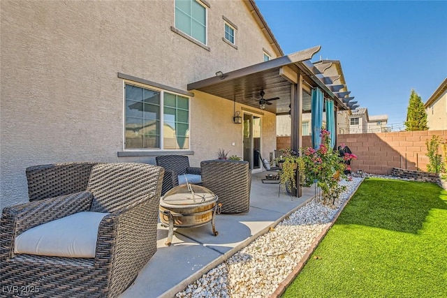 view of patio featuring a fire pit and ceiling fan