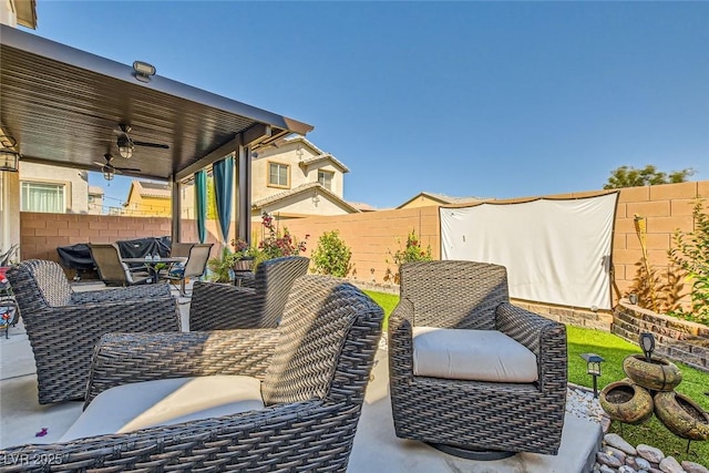 view of patio featuring ceiling fan