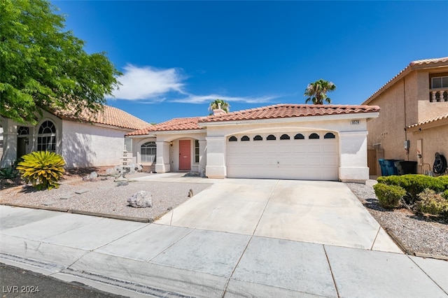 view of front of property featuring a garage