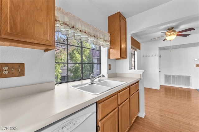 kitchen with sink, light hardwood / wood-style flooring, white dishwasher, and ceiling fan