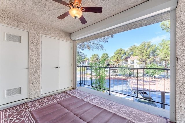 balcony featuring ceiling fan