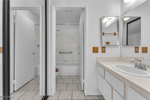 full bathroom with vanity, toilet, tile patterned floors, and tiled shower / bath